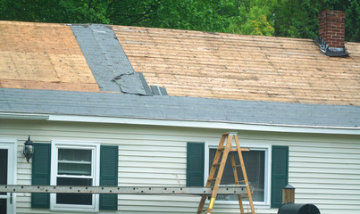 close up on house roof repairing with shingle removed