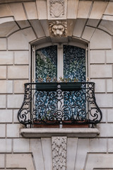 Old French house with traditional balconies and windows. Paris, France.
