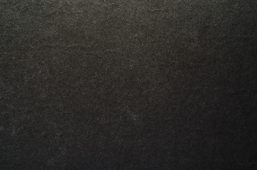 Black graphite texture of cardboard. Rough surface for background