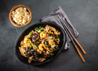Chinese food. Pan of fried beef, pork, chicken, shiitake mushrooms, prawns and spring onion