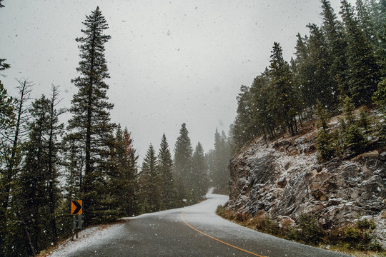 Scenic view of snow fall on mountain road