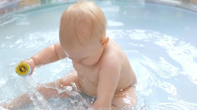 Baby in infant pool