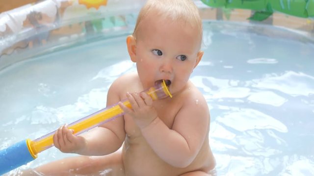 Baby in infant pool