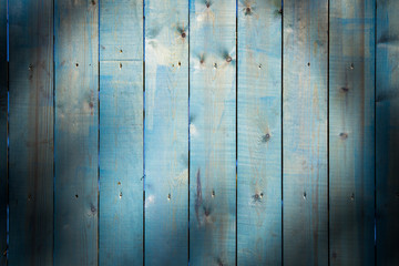 The wooden background is painted in blue