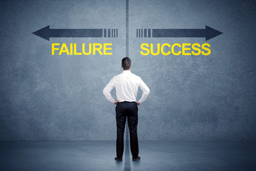Fototapeta na wymiar Businessman standing in front of success and failure arrow concept