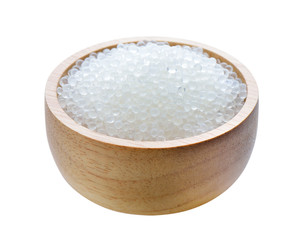 Silica gel in wood bowl on white background