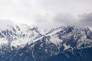 Fototapeta na wymiar Mountain ridge with snowy peaks in Tien Shan