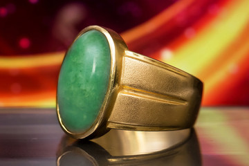 Green Burmese Imperial Jade Ring. And art background