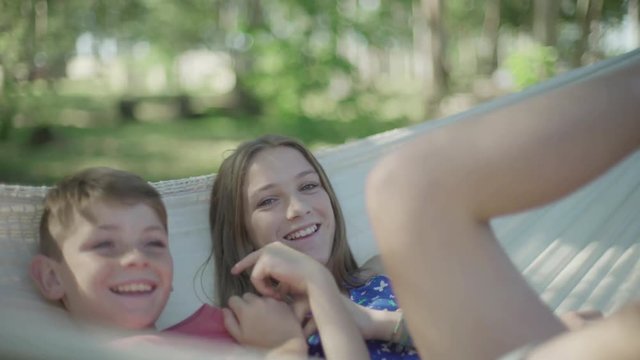 Children in hammock together
