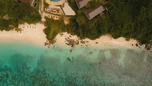Aerial view of beautiful tropical island with white sand beach. Tropical lagoon with turquoise water and white sand. Beautiful tropical beach of Boracay island. Seascape: Ocean and beautiful beach