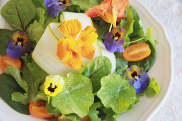 fresh summer salad with edible flowers