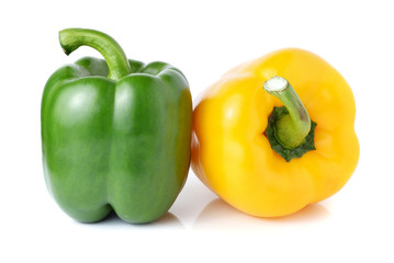 green and yellow pepper isolated on white