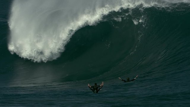 Surfers missing the dream wave in slow motion