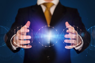 Businessman holding DNA