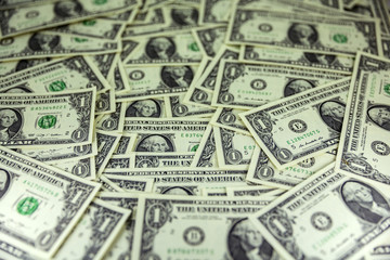 A pile of one dollar bills as texture