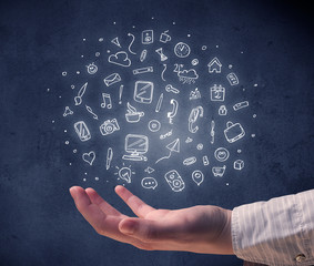 Hand holding mixed drawings