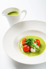 cream soup with tomato and mozzarella