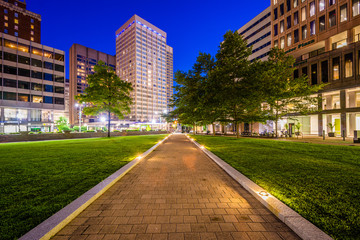 Walkway and buildings at Center Plaza at night, in downtown Baltimore, Maryland.