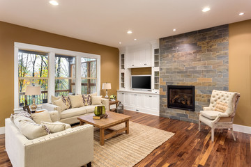 Beautiful living room interior with hardwood floors and fireplace in new luxury home