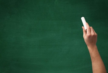 Hand writing on clean blackboard