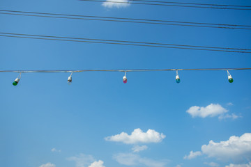 Line of outdoor light bulb with blue sky