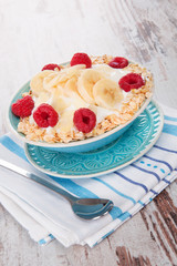 Oatmeal with yogurt and fruits.