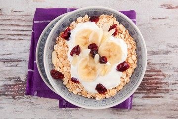 Oatmeal with yogurt and fruits.