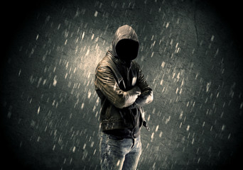 Unknown suspect standing in the dark