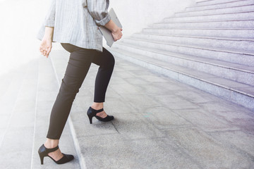 Business working woman steps walking at outdoor stair, side view, Lifestyle and Motivation of modern female concept