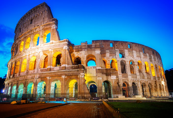 Fototapeta na wymiar view of Colosseum illuminated at blue night in Rome, Italy, retro toned