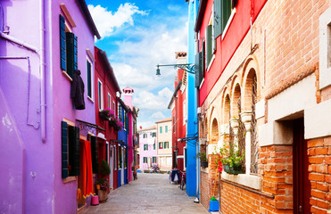 street with multicolored houses of Burano island, Venice, Italy, retro toned