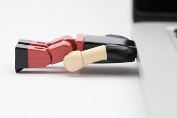 USB stick man with head in laptop