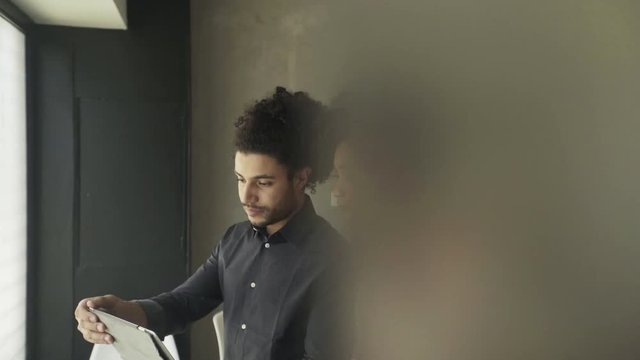 Couple looking at digital tablet together