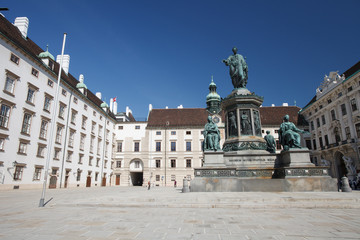 Fototapeta na wymiar View on the inner yard of Hofburg Palace, Vienna, Austria. Monument of Kaiser Franz in the middle of the square