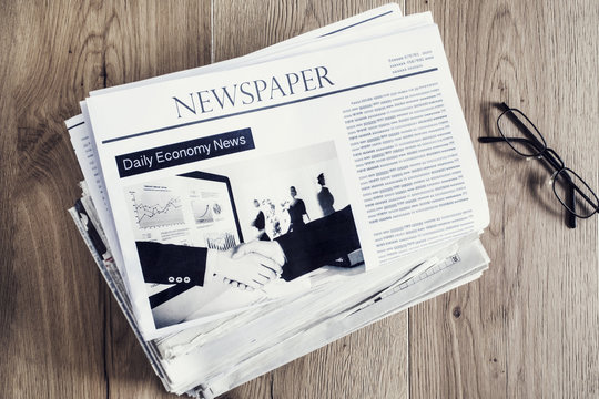 Newspaper on wooden table