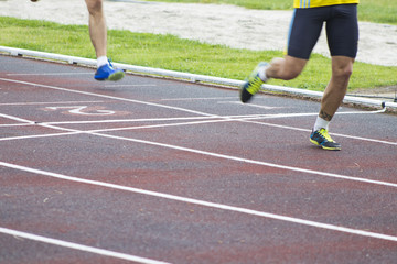 athletes running on the athletics track