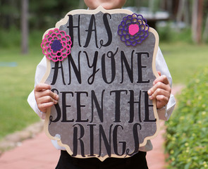 Has Anyone Seen the Rings Sign held by ring bearer - obrazy, fototapety, plakaty