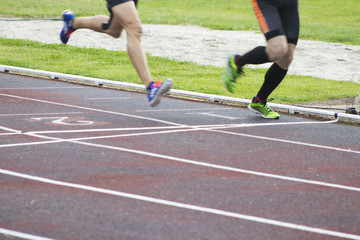 athletes running on the athletics track