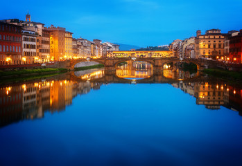 Naklejka premium Ponte Santa Trinita bridge over the Arno River at night, Florence, Italy, retro toned