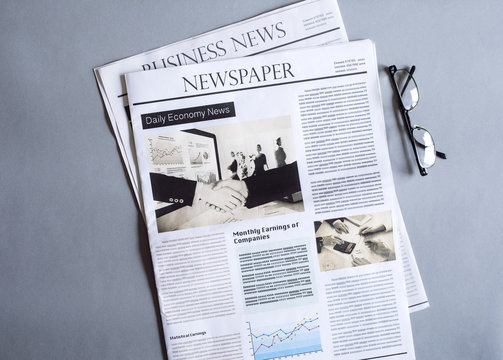 Newspaper on gray background