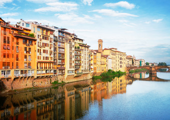 Naklejka na ściany i meble old town houses reflecting in river Arno waters at summer day, Florence, Italy, retro toned