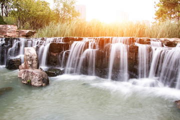 beautiful waterfall with sunbeam