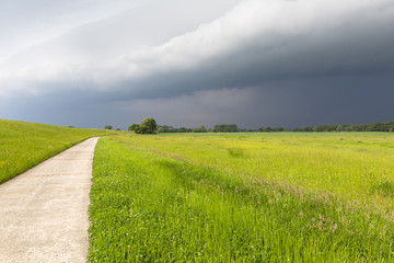 upcoming thunderstorm on Elbe cycle path in Lower Saxony