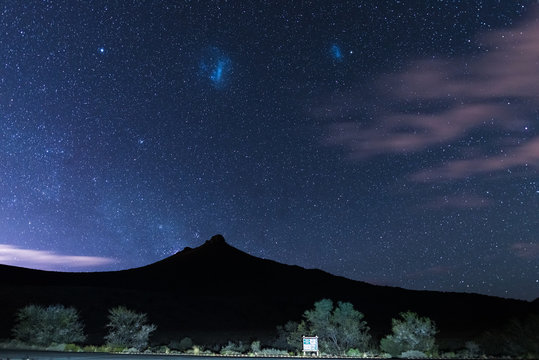 The starry sky and magellanic clouds captured Karoo National Park, South Africa, in winter.