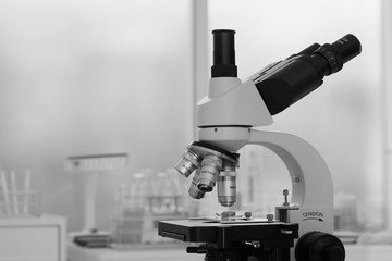 Laboratory lens of Microscope Isolated scientific research background, black and white.