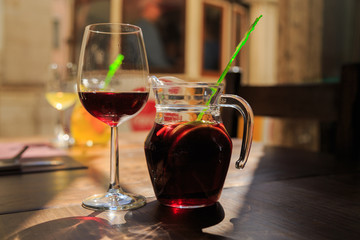 Sanrgiya with fruit ingredients in the decanter. Dripping on the glass.