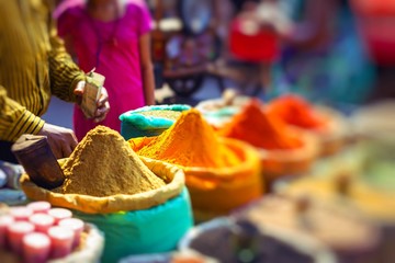 Colorful spices powders and herbs in traditional street market in Delhi. India.