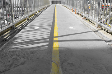 Close up on the middle yellow line of the flyover pathway