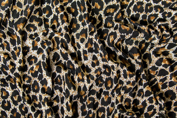 Leopard pattern texture. Textile, piece of clothes.