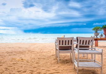 dining table on the beach with a cloudy day